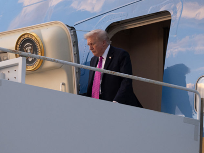 US President Donald Trump disembarks from Air Force One upon arrival at Palm Beach Interna