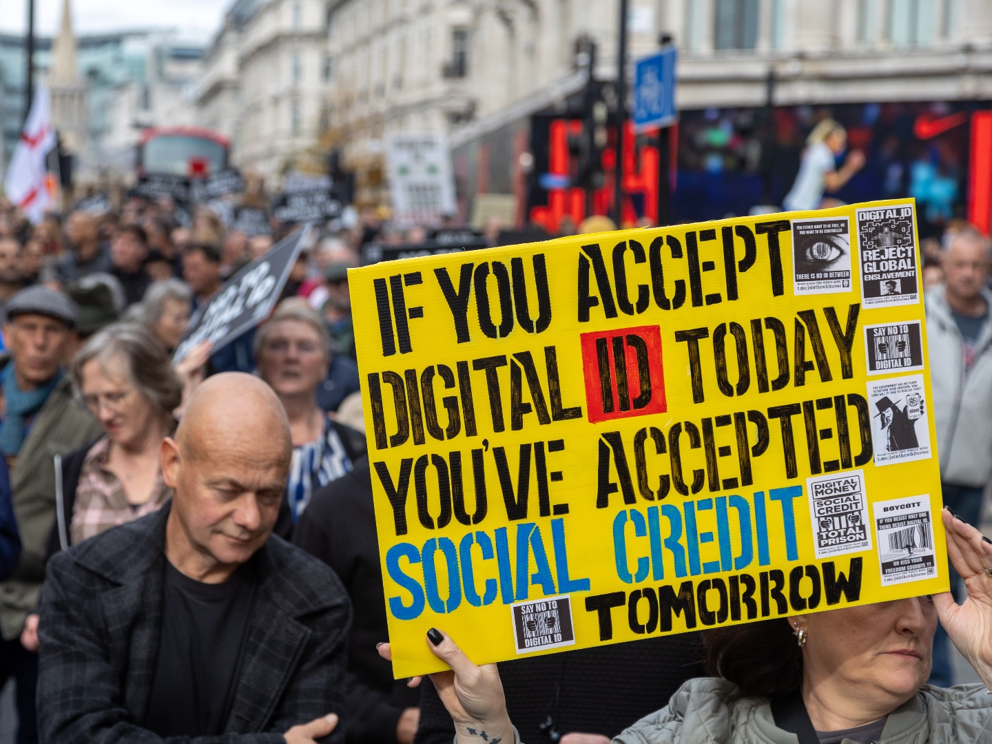 LONDON, UNITED KINGDOM - OCTOBER 18: Protesters march against UK Government's plan to introduce a digital identification card in central in London, United Kingdom on October 18, 2025. The government wants to introduce a digital ID system across the UK, with Prime Minister Sir Keir Starmer saying it will ensure the country's 'borders are more secure'. The IDs will not have to be carried day-to-day, but they will be compulsory for anyone wanting to work. (Photo by Ilyas Tayfun Salci/Anadolu via Getty Images)