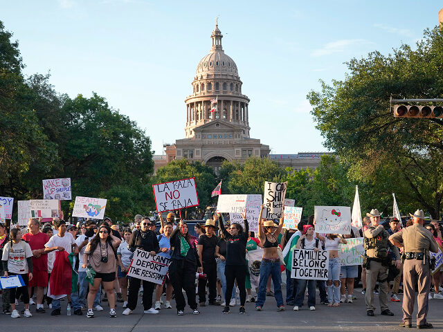 Protesters demonstrate against President Trump at the No Kings protest at the Capitol in A