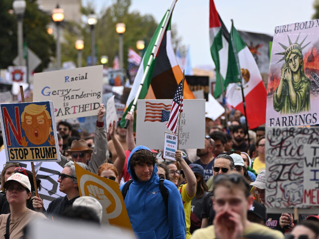 GettyImages-2241630670 (1) CHICAGO, ILLINOIS - OCTOBER 18: People protest as part of the No Kings Rallies on October