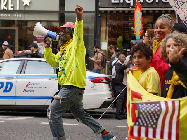 People take part in a "No Kings" protest in Manhattan, New York, the United States, on Oct