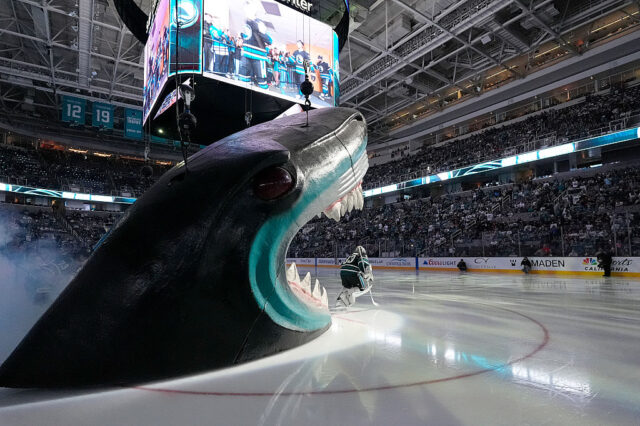 SAN JOSE, CALIFORNIA - OCTOBER 18: The San Jose Sharks skates onto the ice through the Sha
