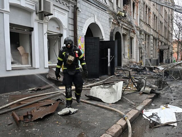 UKRAINE-RUSSIA-CONFLICT-WAR A Ukrainian rescuer walks among debris at the site of a drone attack that hit a kindergart