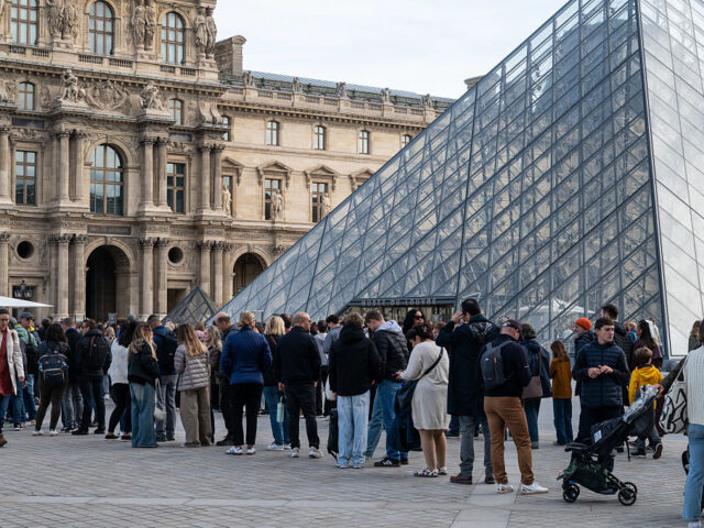 FRA-PARIS-LOUVRE MUSEUM The Cour Napoleon with the Louvre Pyramid in the center of the courtyard, several visitors