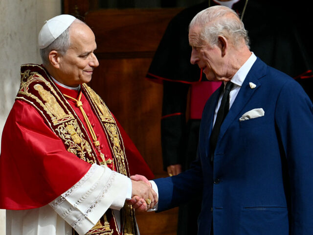 VATICAN-BRITAIN-ROYALS-POPE Pope Leo XIV shakes hands with Britain's King Charles III in San Damaso courtyard dur