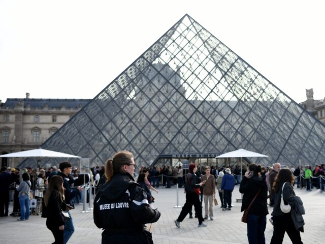 PARIS, FRANCE - OCTOBER 22: Visitors queue up outside the Louvre Museum on October 22, 202