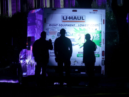 OAKLAND, CALIFORNIA - OCTOBER 23: Police investigate after shots were fired near the Coast