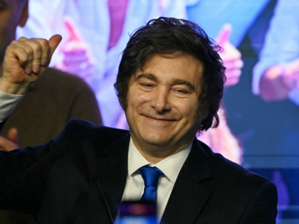 Argentina's President Javier Milei waves to supporters next to the spokesperson for the Pr