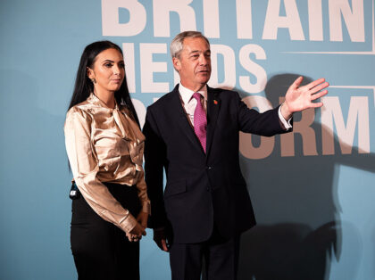 Reform UK leader Nigel Farage (right) and grooming gangs survivor Ellie Reynolds during a