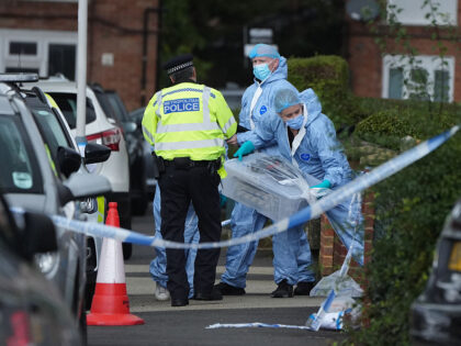 Forensic officers in Midhurst Gardens in Uxbridge, west London, after a man was stabbed to