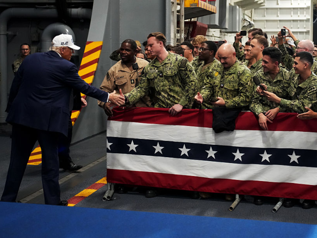 YOKOSUKA, JAPAN - OCTOBER 28: U.S. President Donald Trump greets troops as he departs afte