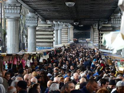 PARIS, FRANCE - NOVEMBER 18: People shop at the Marche Barbes, the outdoor market located