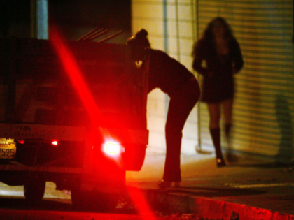 POMONA, CA - NOVEMBER 12: A car slows down for two female police officers posing as prosti