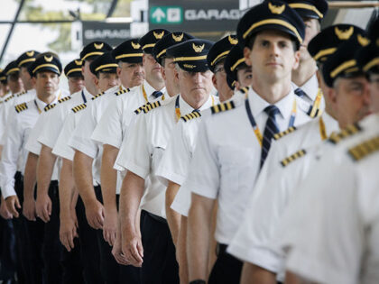 United Airlines pilots picket in the terminal of Washington Dulles International Airport i