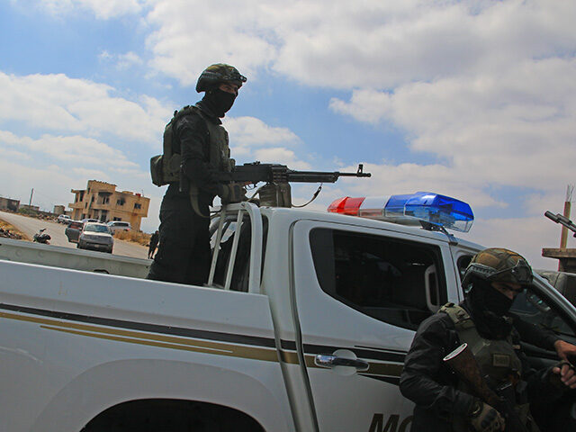GettyImages2225247756 Police forces are deployed on the outskirts of Suwayda to controls the roads as clashes be
