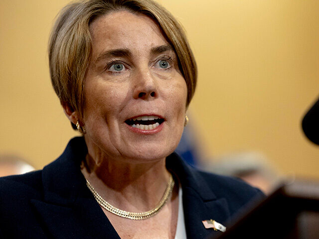 GettyImages2228081004 Massachusetts Governor Maura Healey speaks while surrounded by Texas state legislators dur