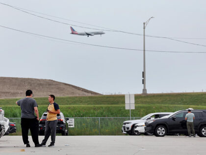 Rideshare drivers wait in a TNP (Transportation Network Providers) Lot on Balmoral Avenue