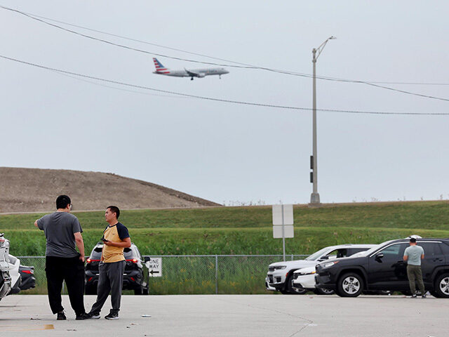 GettyImages2241591957 Rideshare drivers wait in a TNP (Transportation Network Providers) Lot on Balmoral Avenue