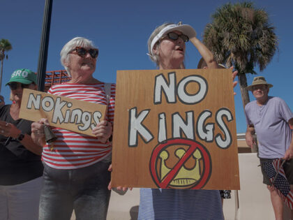 Participants seen holding signs at the protest. On October 18, 2025 over a thousand Venice