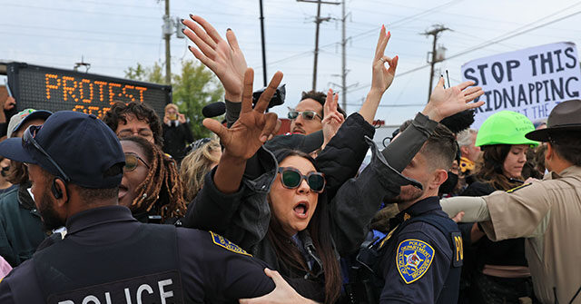Demonstrators interact with police in the street outside of the "Free Speech Zone" near the immigrant processing and detention center on October 17, 2025 in Broadview, Illinois. Demonstrations have been taking place outside of the facility for several weeks as the Trump administration's Operation Midway Blitz has been underway, arresting and detaining immigrants in the Chicago area. (Photo by Joe Raedle/Getty Images)