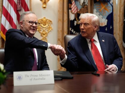 US President Donald Trump, right, and Anthony Albanese, Australia's prime minister, shake