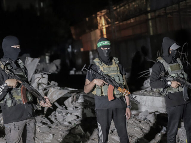 Palestinian militants wearing the uniform of the al-Qassam Brigades, the military wing of
