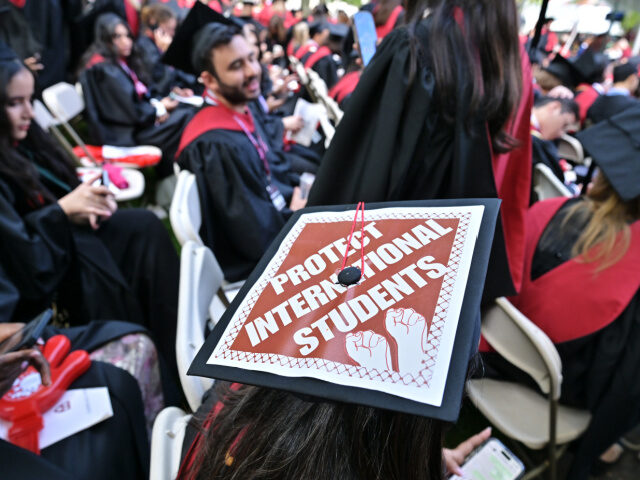 A Harvard University graduate with a message in support of international students on her m