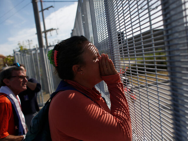 ICE facility in Broadview, IL, a suburb of Chicago A protestor shouts through the fence of the Broadview Immigration and Customs Enforcement