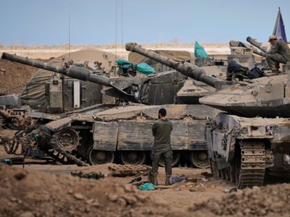 Red Cross workers check the site where members of the Hamas militant group work on searchi
