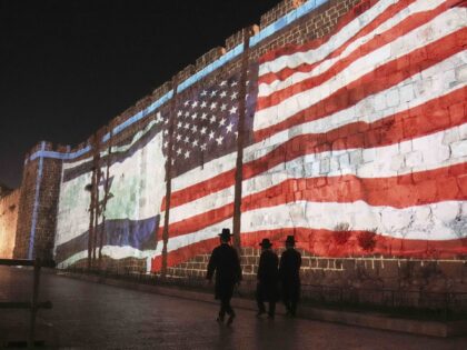Israeli American flag Jerusalem wall (Mahmoud Illean / Associated Press)