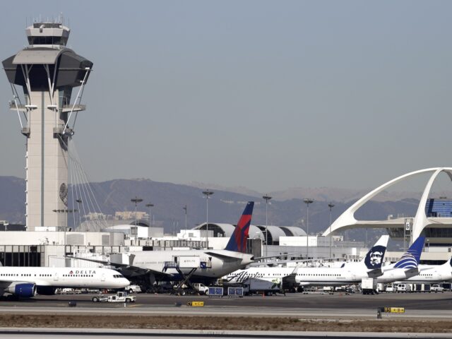 FILE - Airplanes sit on the tarmac at Los Angeles International Airport Friday, Nov. 1, 20