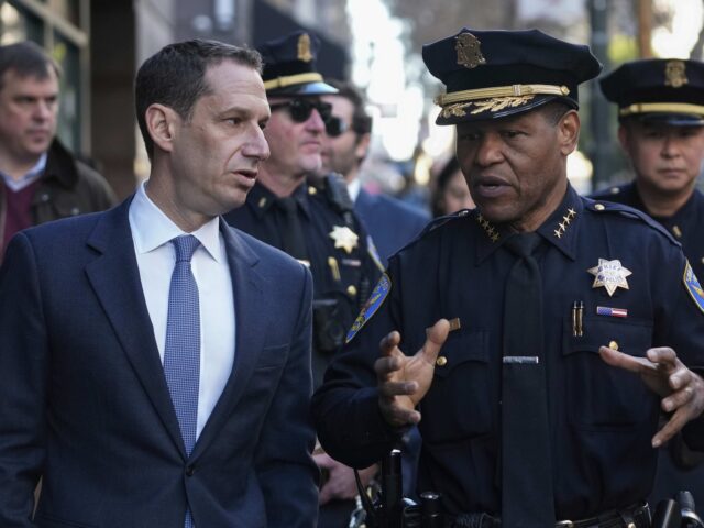 FILE - Mayor-elect Daniel Lurie, left, speaks to San Francisco Police Chief William Scott
