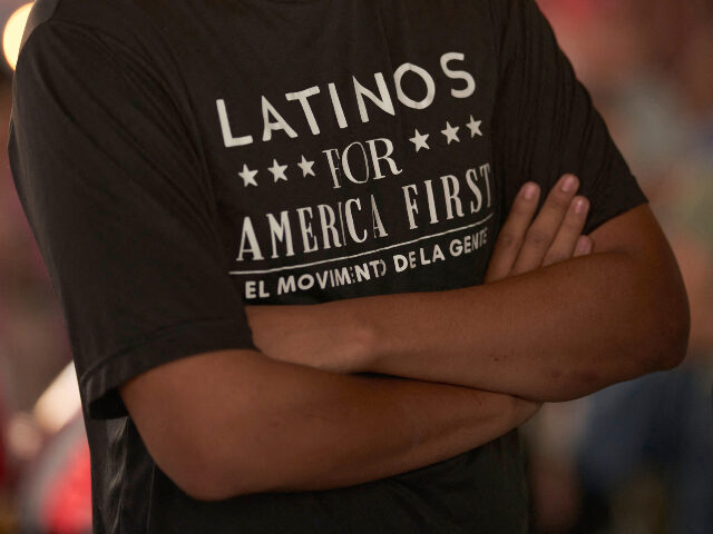 Man with Latinos for America First shirt A man wearing a "Latinos for America" t-shirt attends a campaign event for Repub