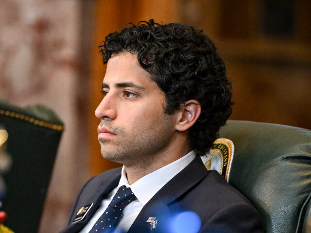 Rep. Manny Rutinel listens to a speaker during the general assembly at the Colorado State
