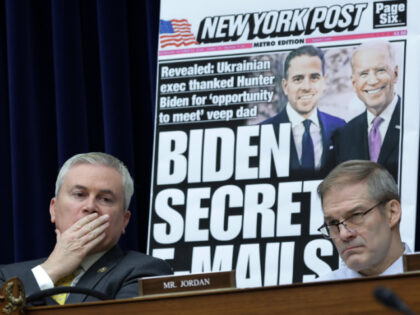 With a poster of a New York Post front page story about Hunter Biden’s emails on display