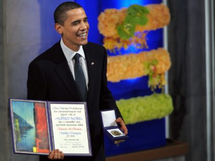 Nobel Peace Prize laureate, US President Barack Obama smiles on the podium with his diplom