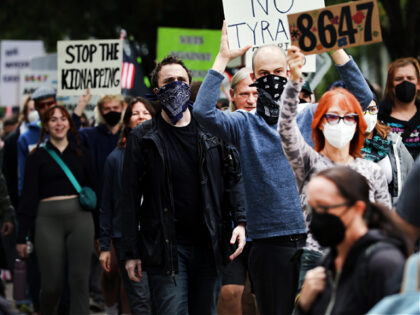 PORTLAND, OREGON - OCTOBER 04: Protesters head towards a downtown U.S. Immigration and Cus
