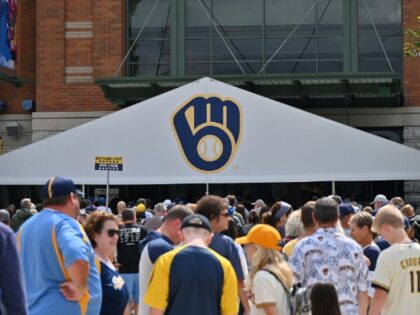 MILWAUKEE, WI - AUGUST 28: Fans line up outside to prior to entering an MLB game between t