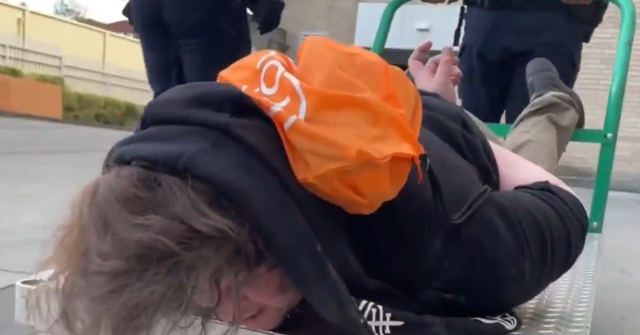 WATCH: ICE Gives ‘Ride’ to Cuffed Portland Suspect on Flatbed Cart During Antifa Riots