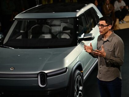 RJ Scaringe with a Rivian EV SUV