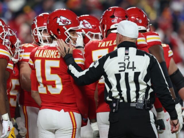 Scott Winters_Icon Sportswire via Getty Images (12) KANSAS CITY, MO - JANUARY 26: Referee Carl Cheffers (34) puts his hand on the back of Kans