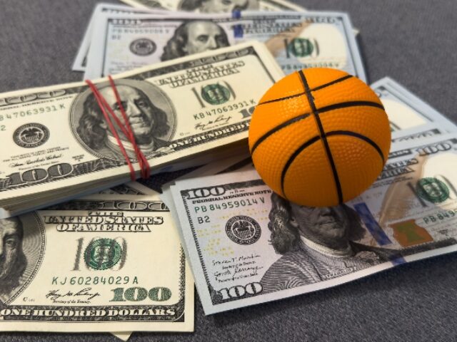 Small basketball on stack of dollars. High quality photo SSUCv3H4sIAAAAAAAAA41Py46DMAz8F5+DFES7lPxK1UMSG2oVSJU4W61Q/n0VSrXXvc3Ynoc3YAQD2JN3iLpxoxub
