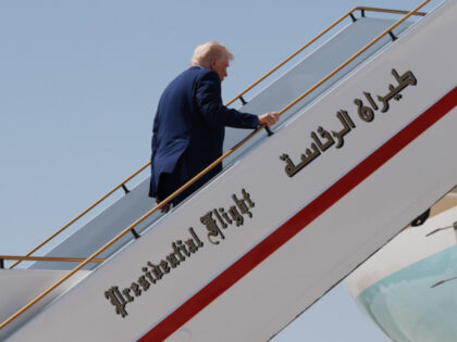 U.S. President Donald J. Trump boards Air Force One as he departs the Al Bateen Executive