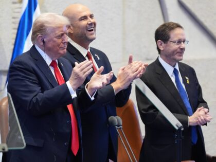President Donald Trump arrives with Speaker Amir Ohana and Israel's President Isaac H