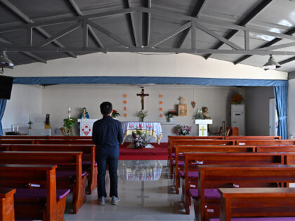 A man looks on at a Catholic church in Zhuozhou, China's northern Hebei province on April