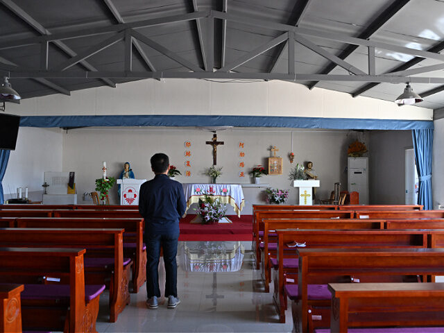 catholic-christian-church-china-file-april2025-gettyimages A man looks on at a Catholic church in Zhuozhou, China's northern Hebei province on April