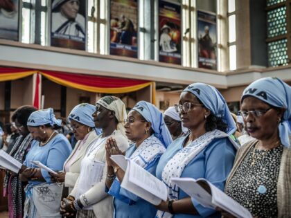 Catholics pray during a Requiem Mass in honour of Pope Francis, held ahead of his funeral,