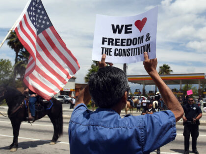 "March Against Sharia Law" protesters and counter protesters face off at Orange