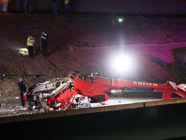 A medical helicopter is shown after it crashed on Highway 50 Monday, Oct. 6, 2025, in Sacr