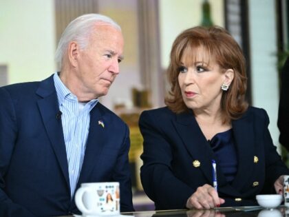 US President Joe Biden (L) speaks with host Joy Behar during a commercial break in a live
